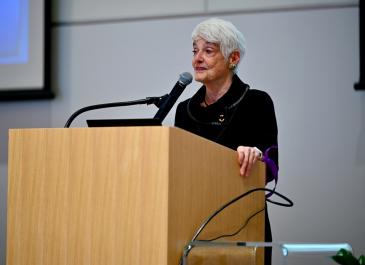 Susanne Bruyere at the podium