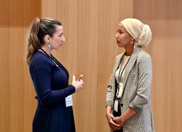 Attendees standing and talking