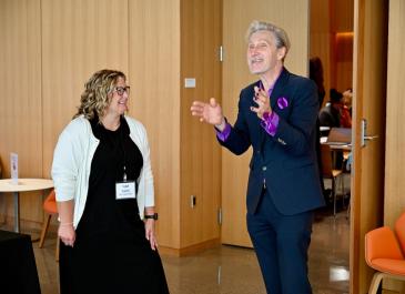 Attendees talking animatedly