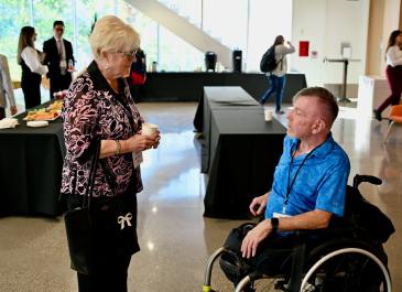 Attendees talking at the break