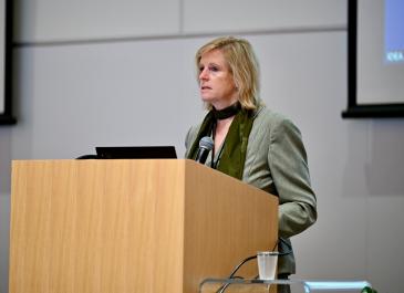 Karen Harlos at the podium