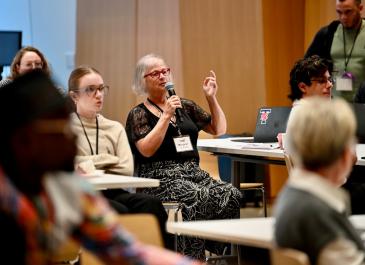 An attendee asking a question from the audiance