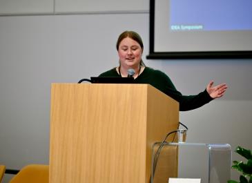 Rebecca Coxon at the podium