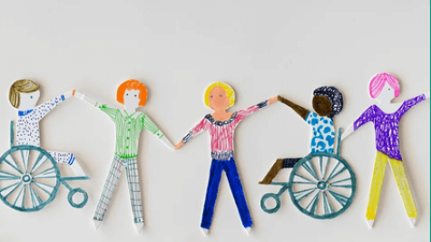 diverse paper cutout figures holding hands