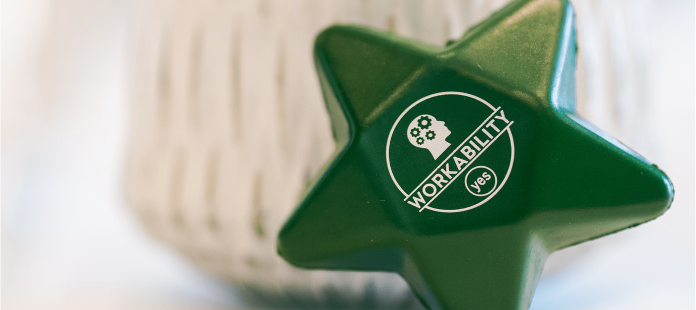 A workability stress star at a table at an employer event