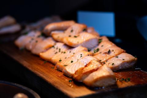 Salmon fillets on a wooden serving platter