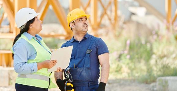 construction workers looking on a work site 