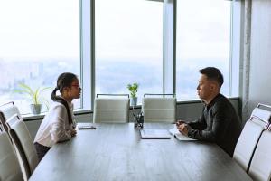 Man and woman sitting face to face across a table